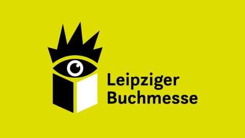 Leipziger Buchmesse Logo vor gelbem Hintergrund Leipziger Buchmesse Logo vor gelbem Hintergrund