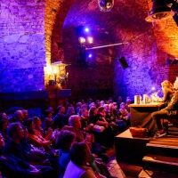 Interior view of the Moritzbastei during a reading on stage with a full audience during the Leipzig Book Fair 2024