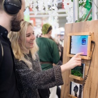 two visitors wearing headphones in the audio world of the Leipzig Book Fair 2025
