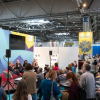 several participants talking on stage at the trade fair stand of the Focus Topic Danube at Leipzig Book Fair 2026